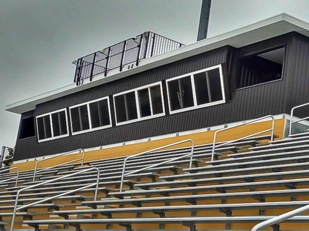 view of press box design, attached to grandstand structure.