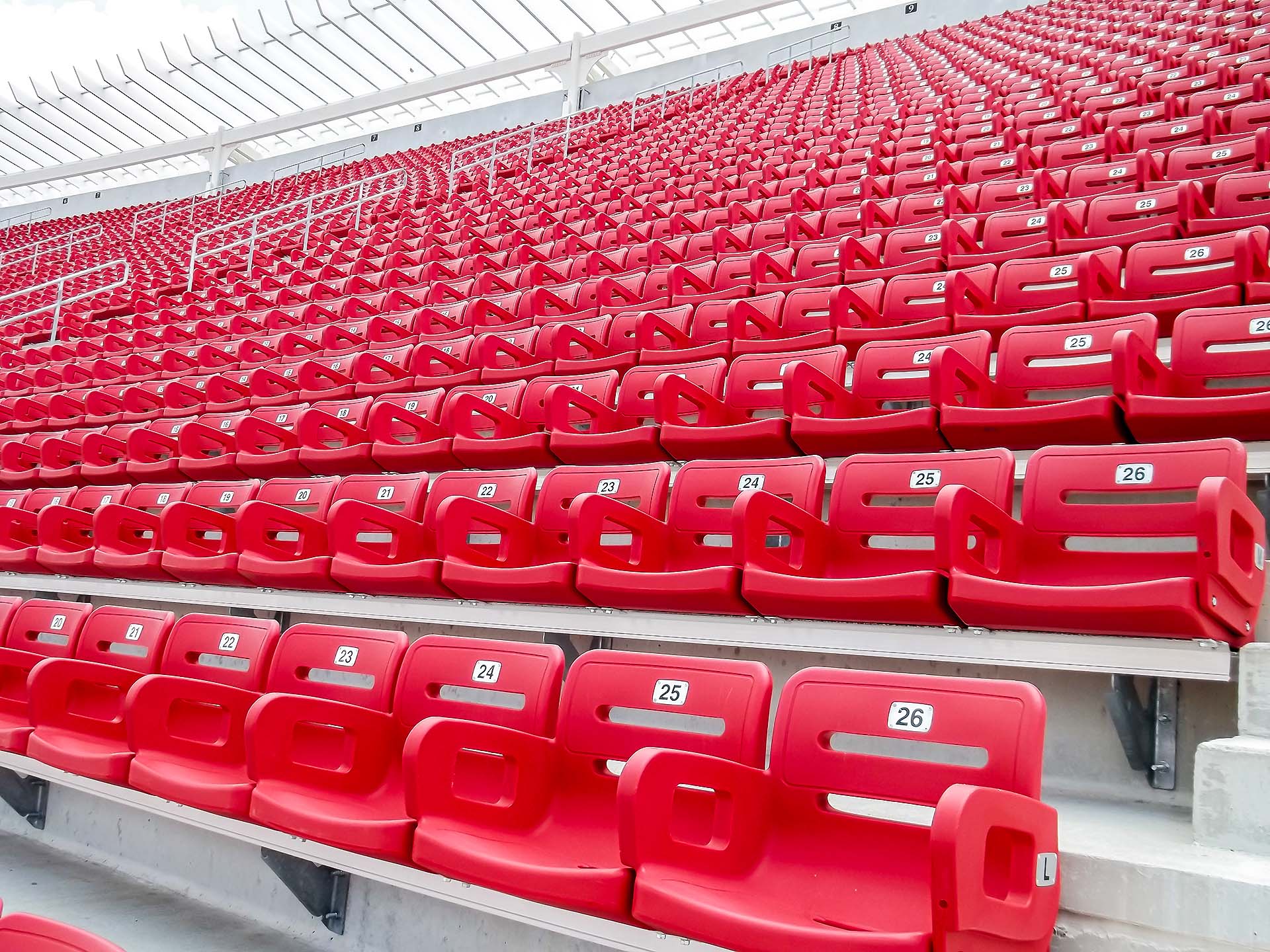 Close-up view of Stadium seats with backs at Cardinal Stadium.