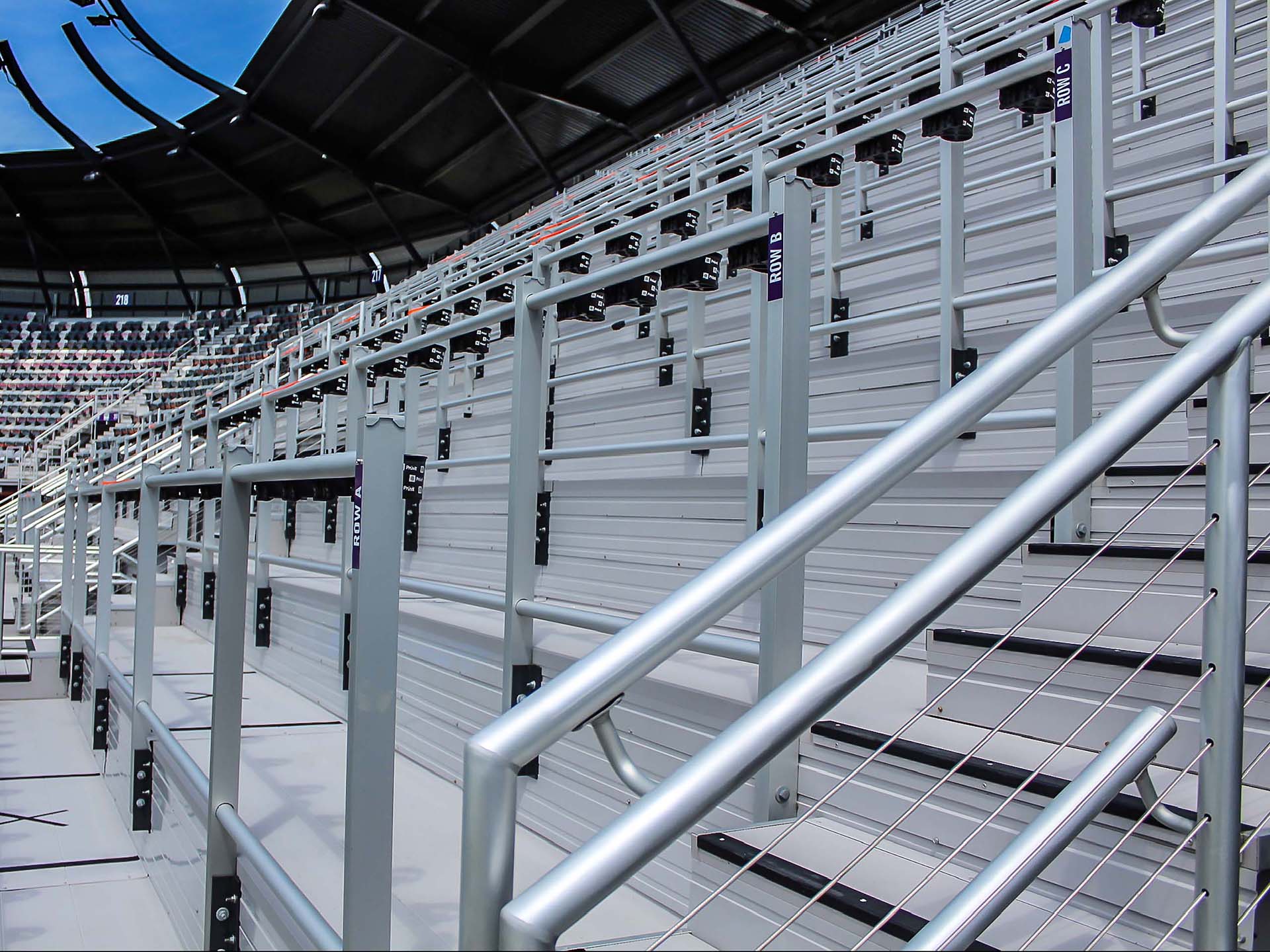 Safe standing aluminum rail system at Lynn Family Stadium.