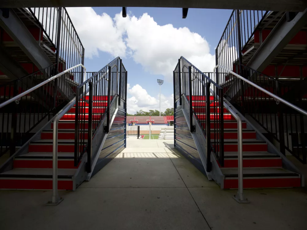 Vertical assist picket rail provides added safety on the stair entrance of Dant Clayton grandstands.