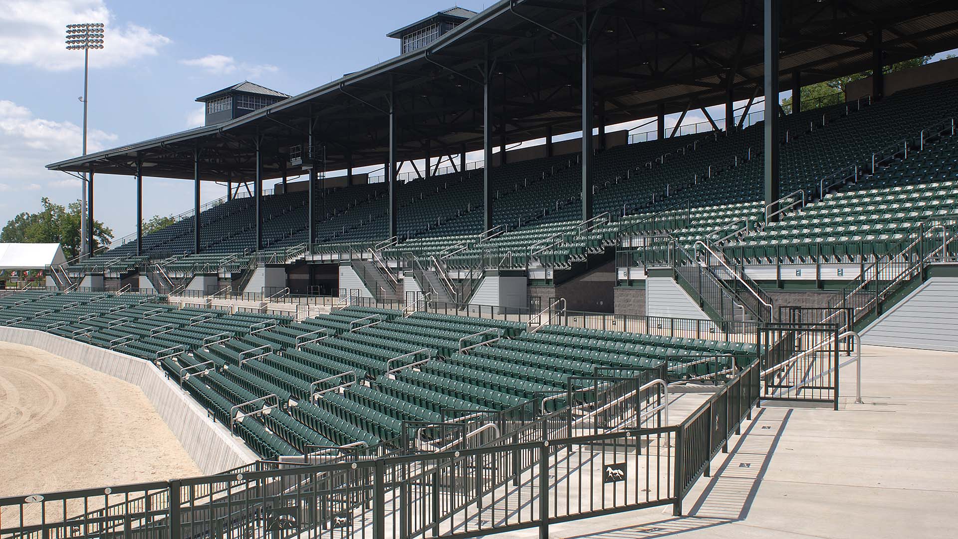 A view of the grandstand seating at Lexington Horse park, finished with an aluminum rail system.