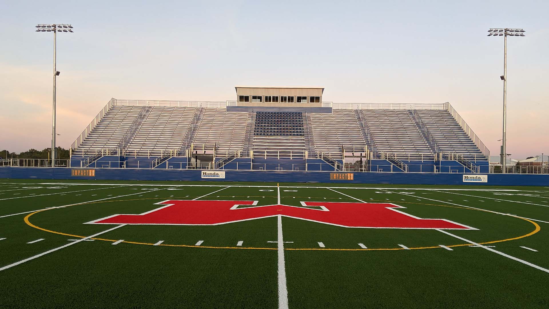 Marysville Highschool stadium grandstand features a press box and aluminum bench seats.
