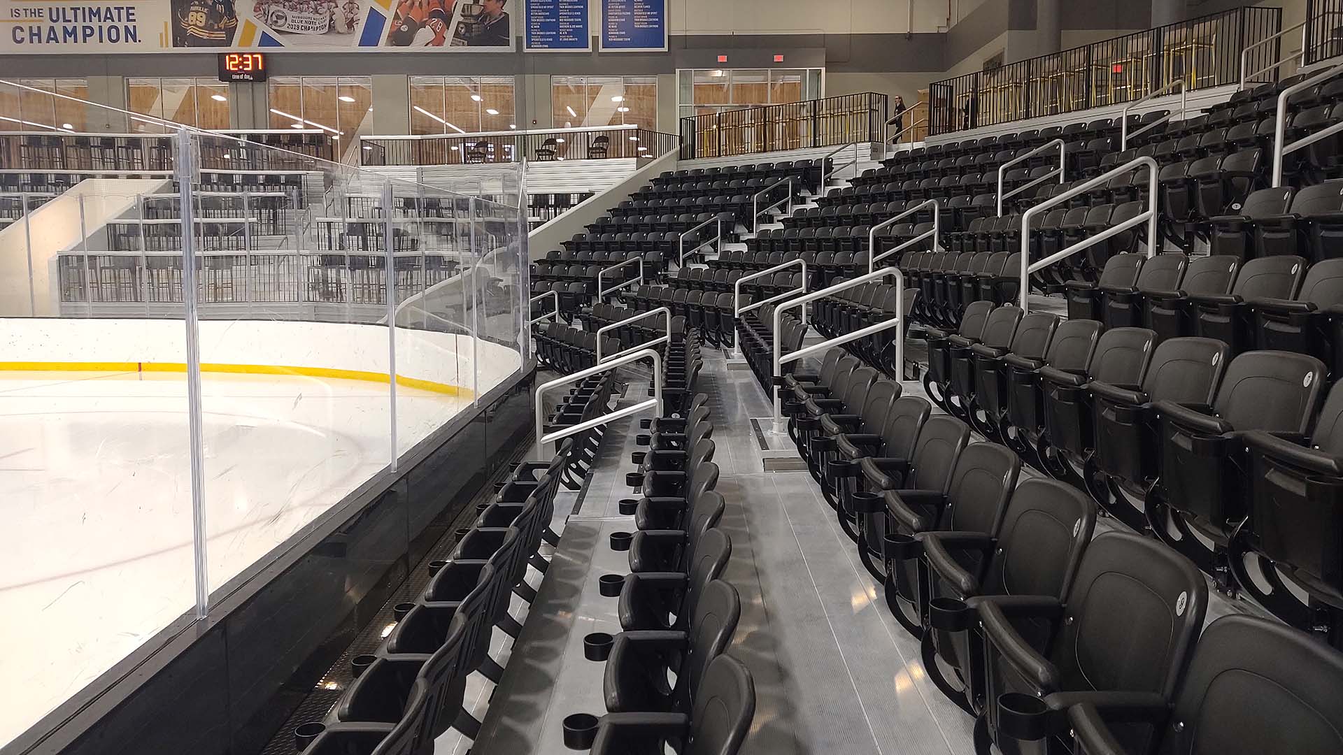 Close-up view of the aluminum rail and custom bleacher seats at Centene Community Ice Center.