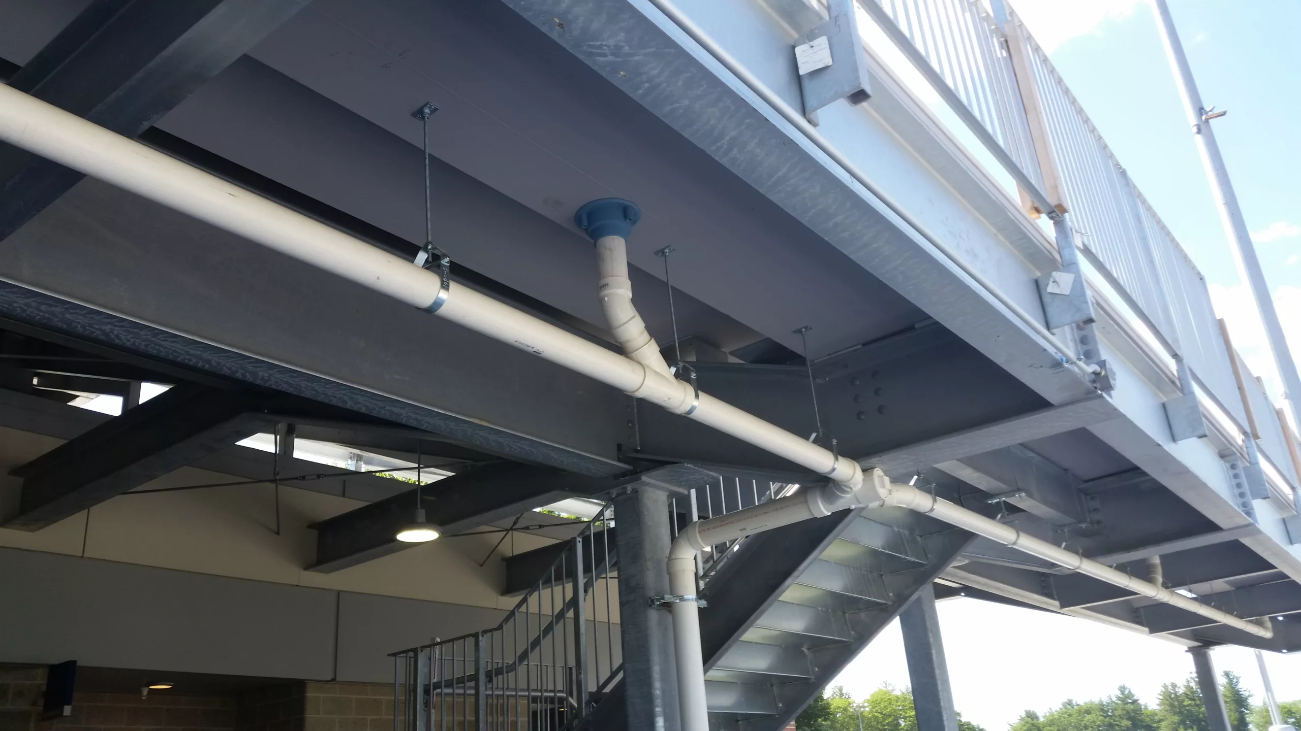 image of drainage system integrated into long span aluminum riser system for water control
