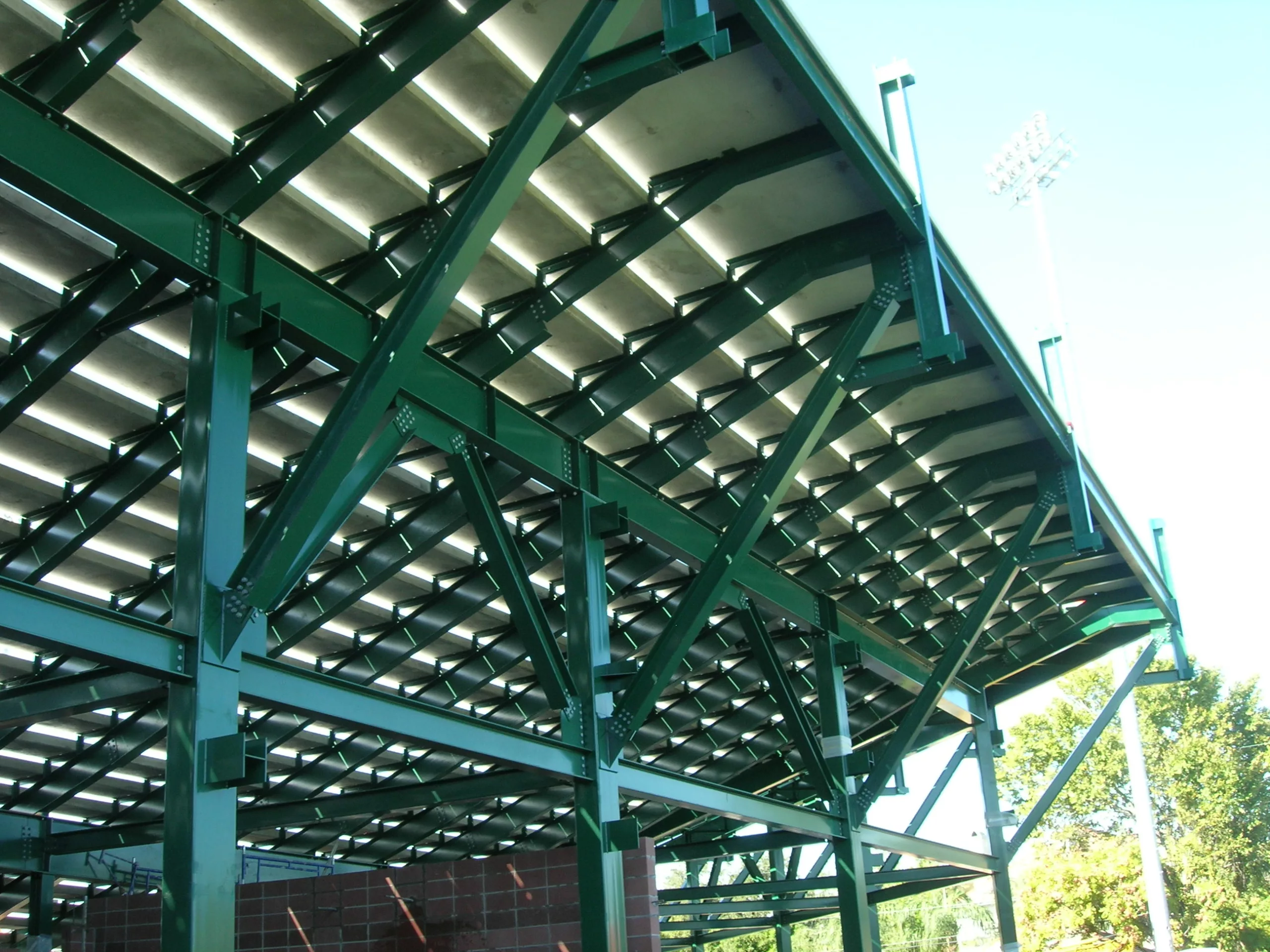 Steel support structure for hybrid precast system - steel features a green powder coated finish
