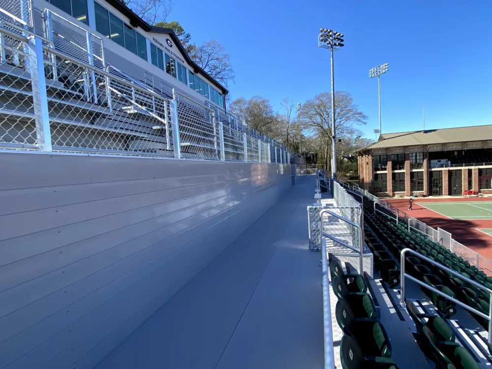 Close up shoot of UGA Tennis Center grandstand showcasing gray aluminum riser closure