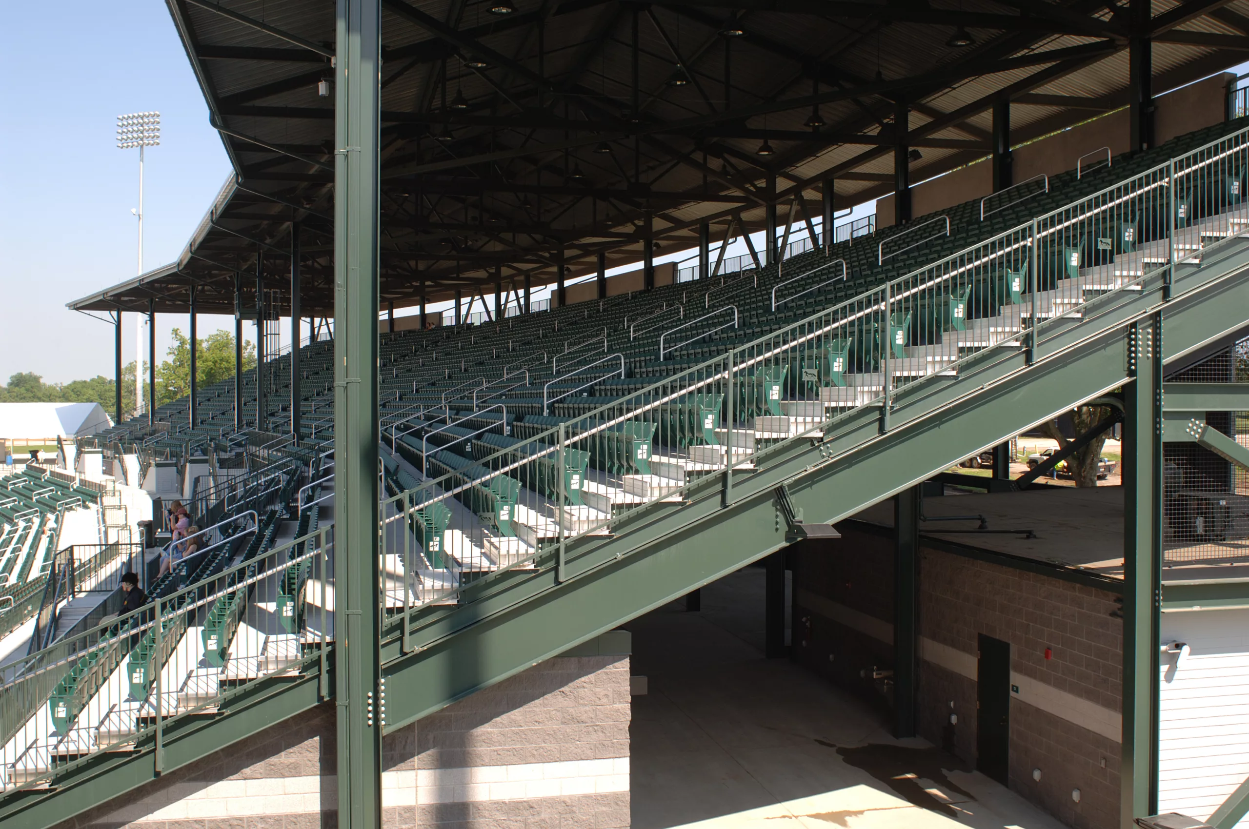I-beam grandstand with custom roof structure, steel is powder coated green. Kentucky Horse Park